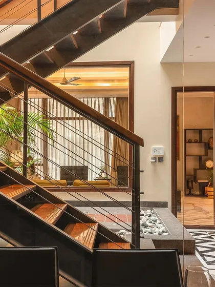 This angle shows how the open staircase design allows for visual connection between different areas of the home. You can see through to the living area, which makes the entire ground floor feel like one fluid space.