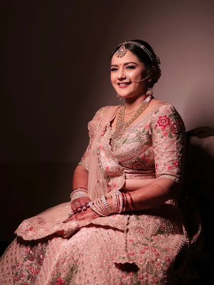 Simplicity never looked so stunning. This bride's pastel lehenga is paired with soft rose makeup, highlighting the beauty in the details.