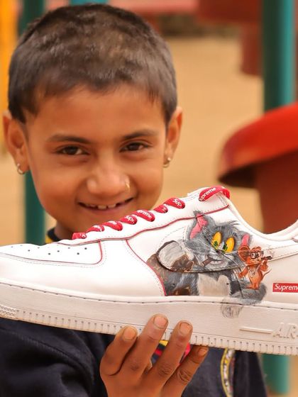This little guy's happy face makes all the hard work worth it. It was a joy to see his reaction to the finished Tom and Jerry custom sneakers.