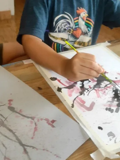 A beautiful cherry blossom painting created using the fun and unpredictable technique of straw painting.