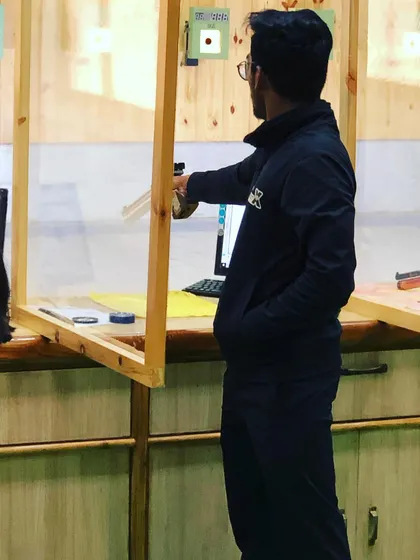Precision in practice. Here is Manoj Sharma during a competition, demonstrating the steady stance and focus that led him to qualify for the pre-nationals.