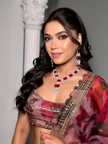 A close-up of the Roka makeup. The look features a glamorous smoky eye with a hint of shimmer, balanced by a soft nude lip and glowing skin.