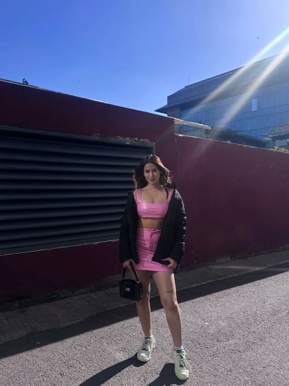 A confident pose in the trendy pink co-ord.