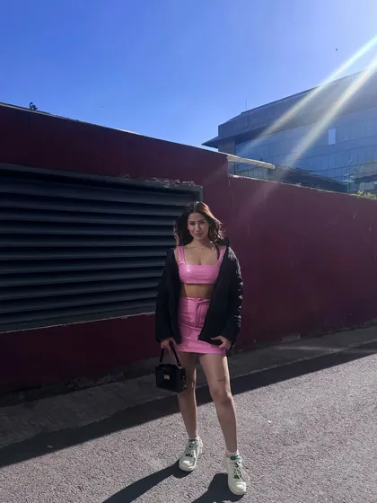 A confident pose in the trendy pink co-ord.
