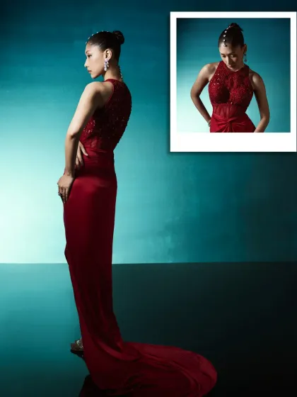 A sculpted silhouette for the contemporary wardrobe. This structured red gown, with its clean lines and artful draping, blends polish with ease, creating a look that is both powerful and gracefully feminine.