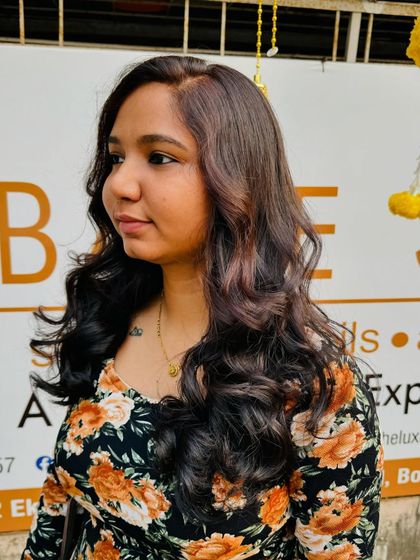 The perfect angle to see the subtle tones and healthy shine of her new global hair colour.