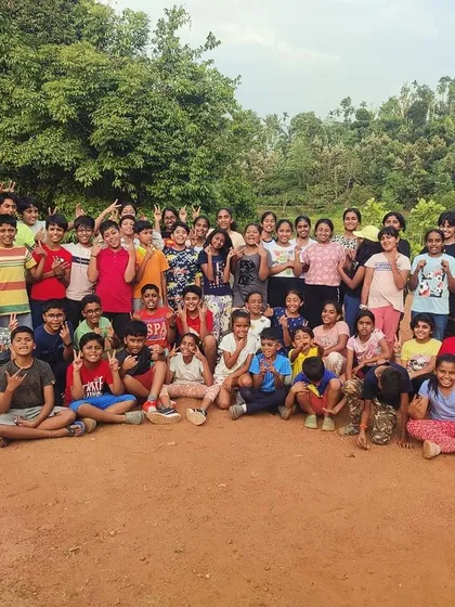 A large group photo of all the happy campers at the end of a successful Adventure and Nature Awareness Camp in Barapole.