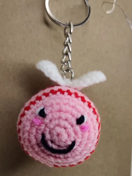 My super popular bumblebee keychains. They come in the classic yellow and black, but I also make them in fun colors like pink, blue, and purple.