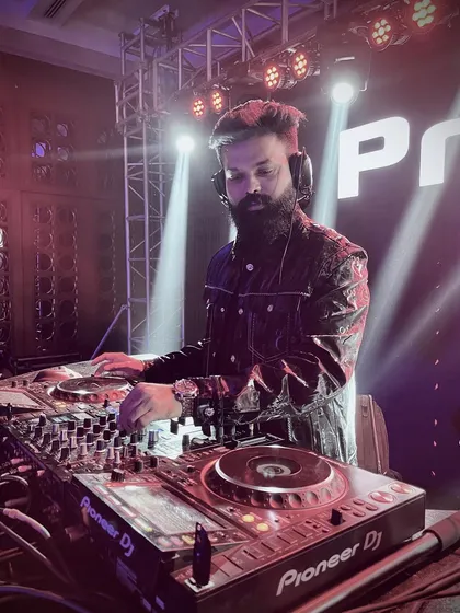 Focused and in the zone. This is me behind the decks, where I feel most at home, mixing tracks and building the energy for the night. A great DJ set is all about reading the room and crafting the perfect musical journey.