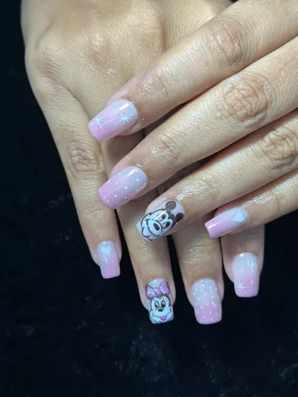 For the Disney lover. This cute set features a pink and white ombre with hand-painted Mickey and Minnie Mouse characters.