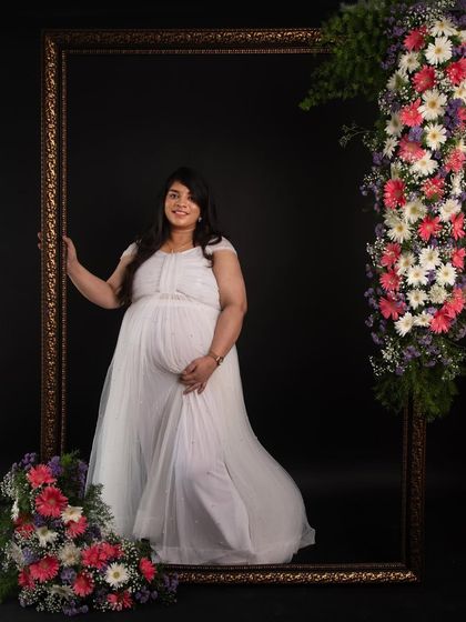 A confident and happy portrait in our fresh flower frame setup. This is part of my luxury package, designed to make you feel pampered and special.