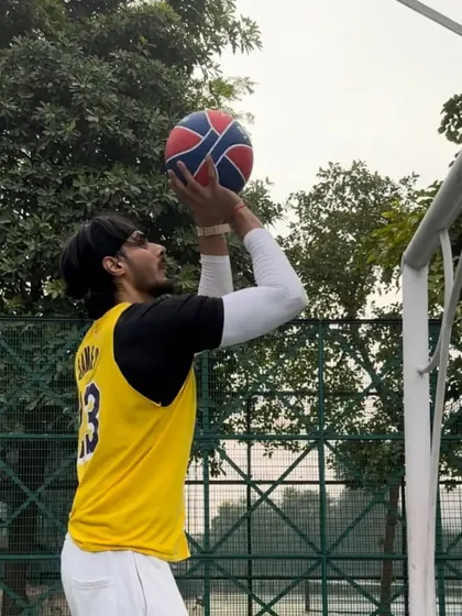Working on shooting form with a tall player. We focus on the fundamentals that will make him a versatile threat on the court.