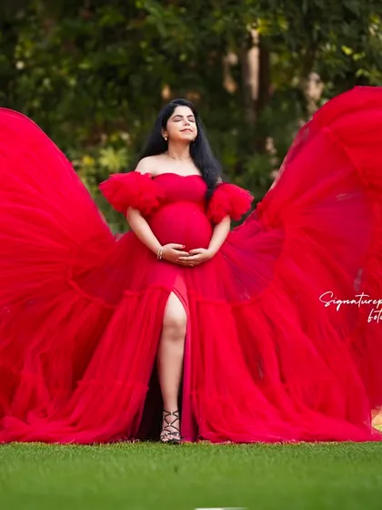 I believe every mother deserves a moment to feel like a force of nature. This outdoor session, with a vibrant red gown flowing like wings, is all about capturing that powerful, breathtaking beauty in a stunning natural setting.