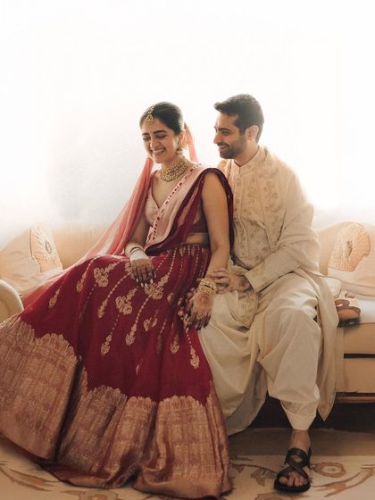 A moment of shared laughter in a room filled with soft light. My goal is to capture you at ease, as if I am not even there. This candid portrait reflects the simple joy of being present with the one you love on your wedding day.