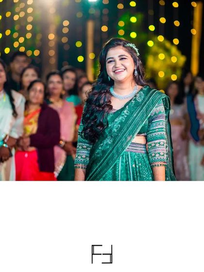 The bride's radiant smile as she watches the evening's performances. Capturing these moments of joy and appreciation is a key part of documenting the reception.