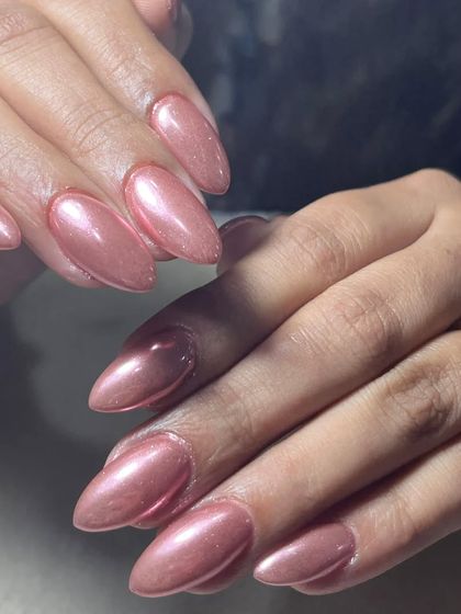 Rose gold chrome is a client favorite for a reason. It's a warm, flattering metallic that looks incredibly chic and modern on these almond-shaped extensions.