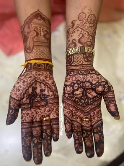 The beautiful dark stain of the Radha Krishna and peacock design. You can see how my natural henna paste gives such a rich color.