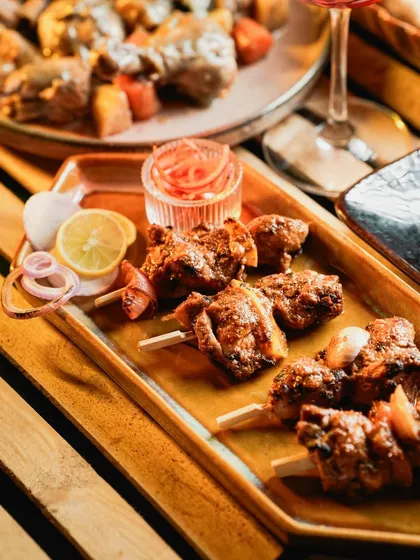 These Murg Adani Boti skewers are juicy, smoky, and incredibly satisfying. Each piece of chicken is marinated and grilled, perfect for a live appetizer station at any party.