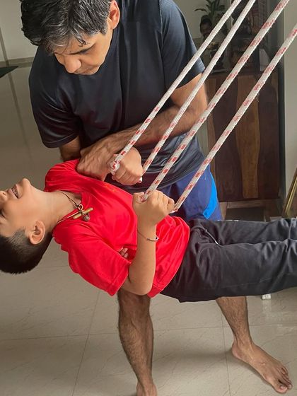 Using the ropes to play and build strength. This is not about performance but about making the practice fun and accessible, helping children connect with their bodies in a joyful way.