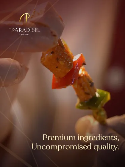 A close-up of a paneer tikka skewer, showcasing the premium ingredients and rich marinade. We believe in uncompromised quality in every single bite.