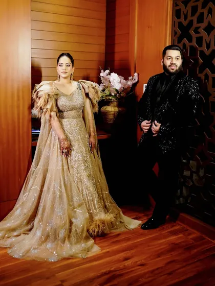 A stylish portrait of the couple at their Sangeet, showcasing their glamorous party outfits.