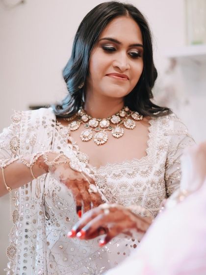 A candid moment from my baby shower, adjusting my custom hand harness. This piece was designed to be comfortable yet elegant, perfect for a long day of celebrations.