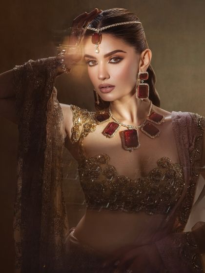 The play of light in this shot adds a magical quality to the makeup. This is a perfect example of a high concept beauty look.