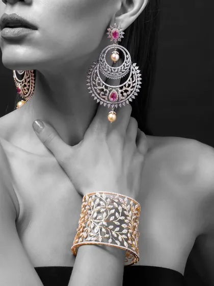 The magic of diamonds. For Yoube Jewellery, I used a monochrome approach with selective color to make the ruby and pearl earrings stand out. This technique turns the image into a piece of art, highlighting the jewelry's color and form.