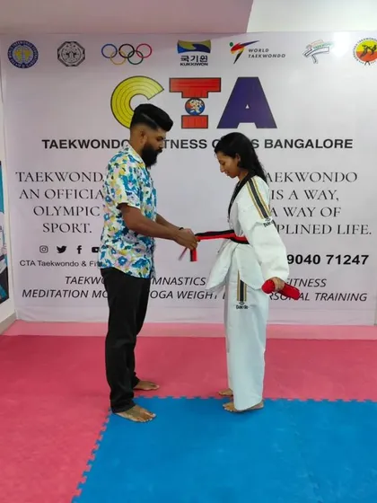 Tying a red belt.