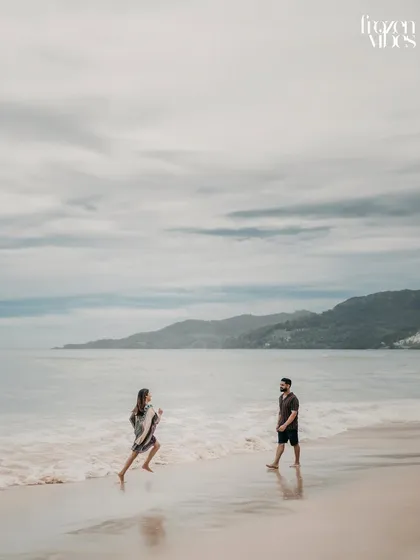 Komal and Harman enjoying a playful run along the shoreline. I encourage couples to interact naturally, which results in photos that are full of life and energy.