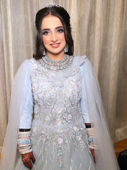 Walima glam for our gorgeous bride, who looks like a princess in this powder blue gown and tiara. The makeup is soft and shimmery to match.