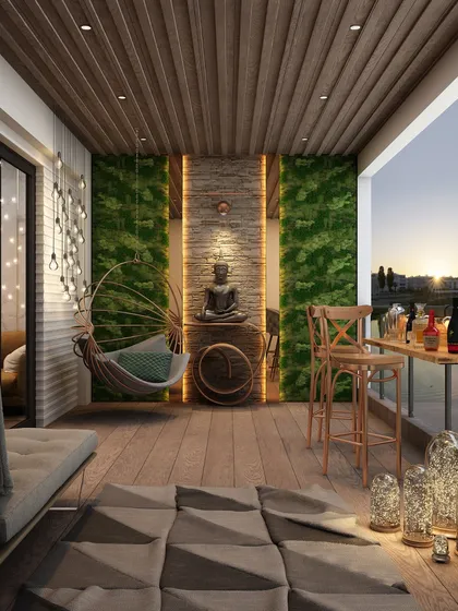 Your outdoor space is a sanctuary waiting to happen. This balcony design uses a meditative Buddha centerpiece, lush green walls, and warm lighting to create a golden-hour retreat, perfect for unwinding as the sun dips below the skyline.