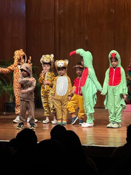 Our animal kingdom cast, featuring a giraffe, tiger, and bear, ready to charm the audience.