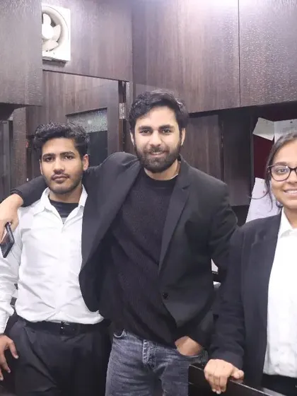 A candid moment in the office with my colleagues. A positive and collaborative office environment is key to our success.