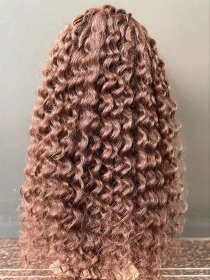 Our premium curly wig in dark brown offers amazing volume and length. It's comfortable for everyday use and glamorous enough for special occasions.