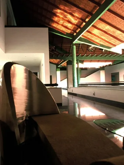 At the LMW Headquarters in Coimbatore, I used a series of courtyards to structure the low-rise building. This interior view shows how these open spaces create a traditional spatial sensibility, with a custom metal sculpture adding an artistic focus.