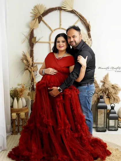 A classic couple's portrait in the boho setup. The warm lighting and natural elements create a relaxed and happy mood.