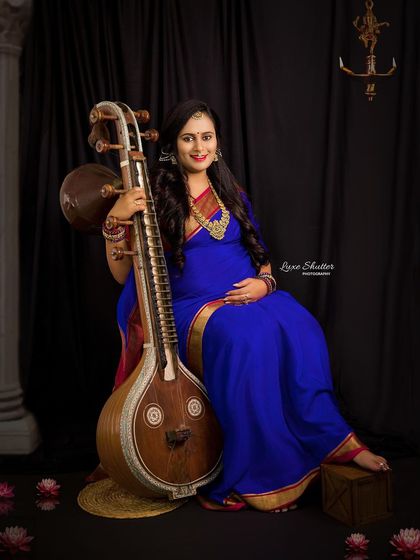 A unique and personal traditional portrait. This mother-to-be, a musician, wanted to include her Veena in the shoot, creating a beautiful fusion of her passion and her pregnancy journey.