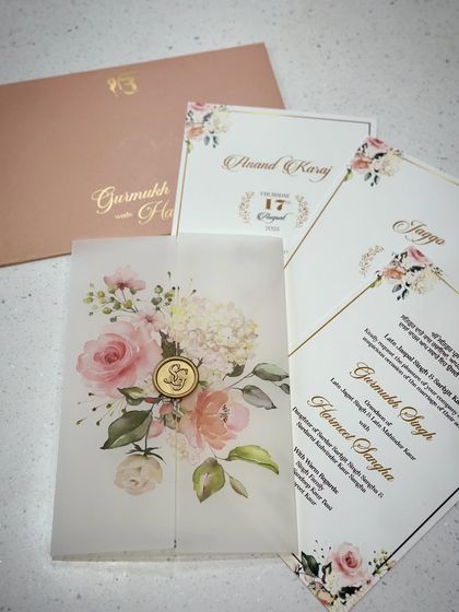 Our bestseller vellum invite, designed for a Sikh wedding. The card features a beautiful floral design, a translucent vellum jacket, and a custom wax seal.
