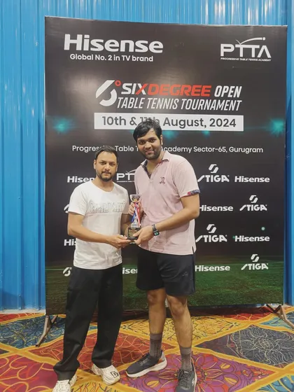 We also host a corporate category for working professionals looking for a competitive challenge. Here, I am presenting the 3rd place trophy at the Sixdegree Open Table Tennis Tournament.