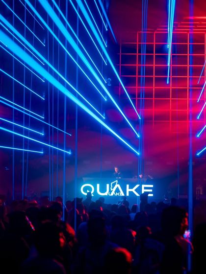 A stunning display of blue and red lasers crisscrossing over the crowd at Quake.
