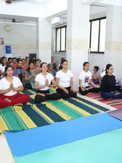 A group of students sits in meditation during our International Yoga Day celebration at the institute. The shared silence and collective focus create a powerful atmosphere for deep practice.