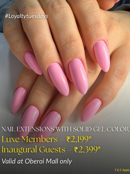 A beautiful set of long, coffin-shaped nail extensions in a solid bubblegum pink gel color. This is a perfect example of a bold and clean look achieved with my extension services.