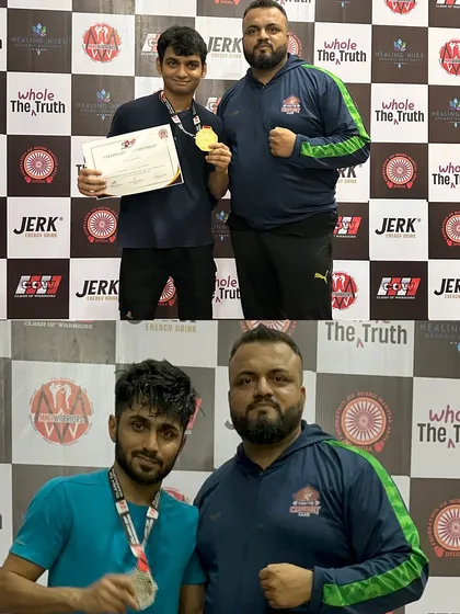 Me with two of our fighters and their medals. Guiding them on this journey and seeing them succeed is my greatest reward as a coach.