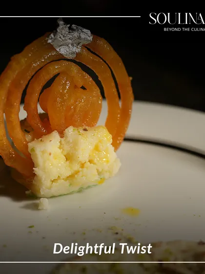 A delightful twist on a classic Indian dessert. A miniature, perfectly crisp jalebi is placed atop a creamy base, showcasing our innovative approach to traditional sweets.