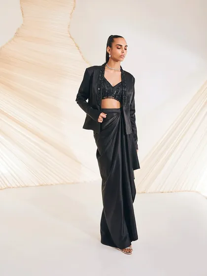 The Debro Jacket Set, captured to show the modern silhouette and the contrast between the structured blazer and the fluid draped skirt.