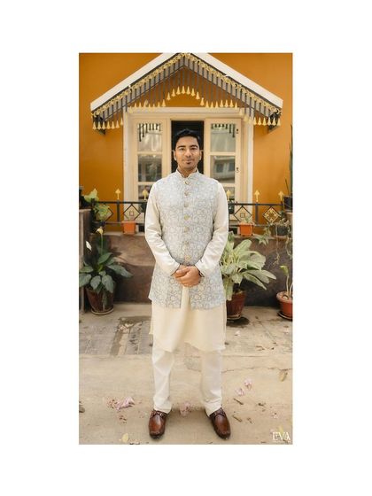 A portrait of the groom-to-be, Bhuvan, looking dapper in his traditional kurta and vest for the engagement ceremony.