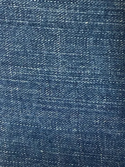 A medium-fade denim with a visible crosshatch weave. This fabric offers a great balance of color and texture for a classic denim look.