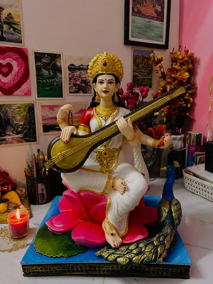 Besides large backdrops, I also do detailed painting work on fiber murtis. This is a Saraswati idol I painted for Dussehra, focusing on bringing the features to life with careful color application and delicate brushstrokes.