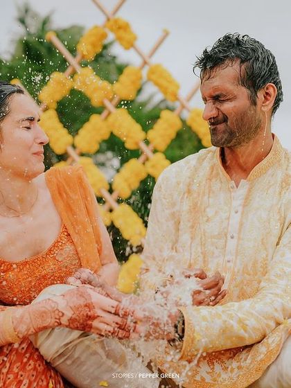 Laughter and splashes during Eli and Suman's Haldi. I am not afraid to get close to the action to capture the genuine fun of the moment.